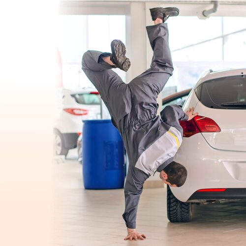 Man dancing at car dealership